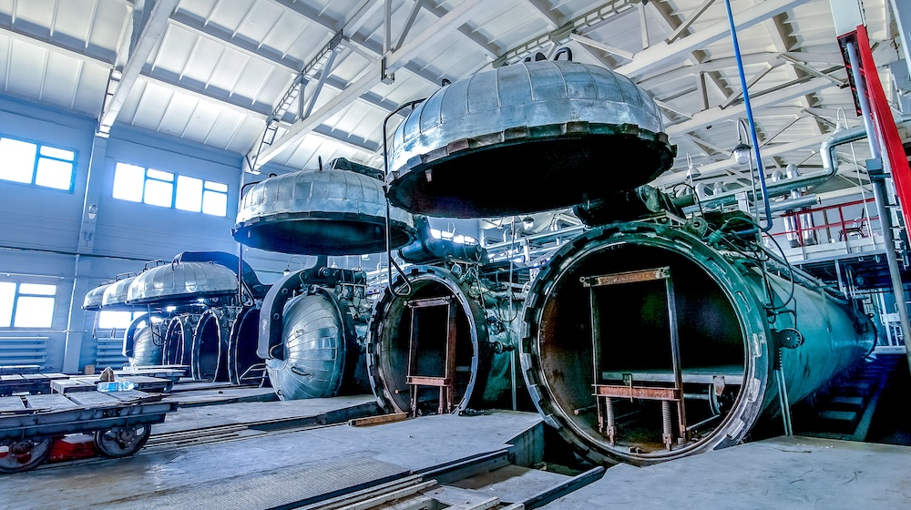 factory premises with opened autoclaves for concrete blocks production