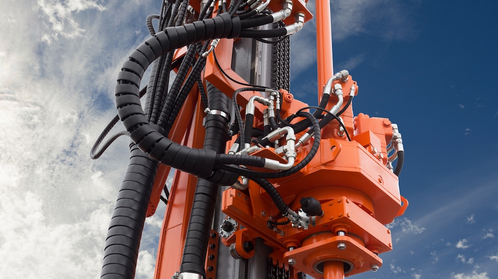 Elements of Hydraulic crawler oil drill machine on blue sky